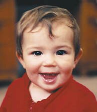 A very happy baby from the COTS Children's Haven