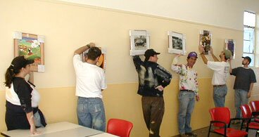 Calix volunteers painting the Kitchen